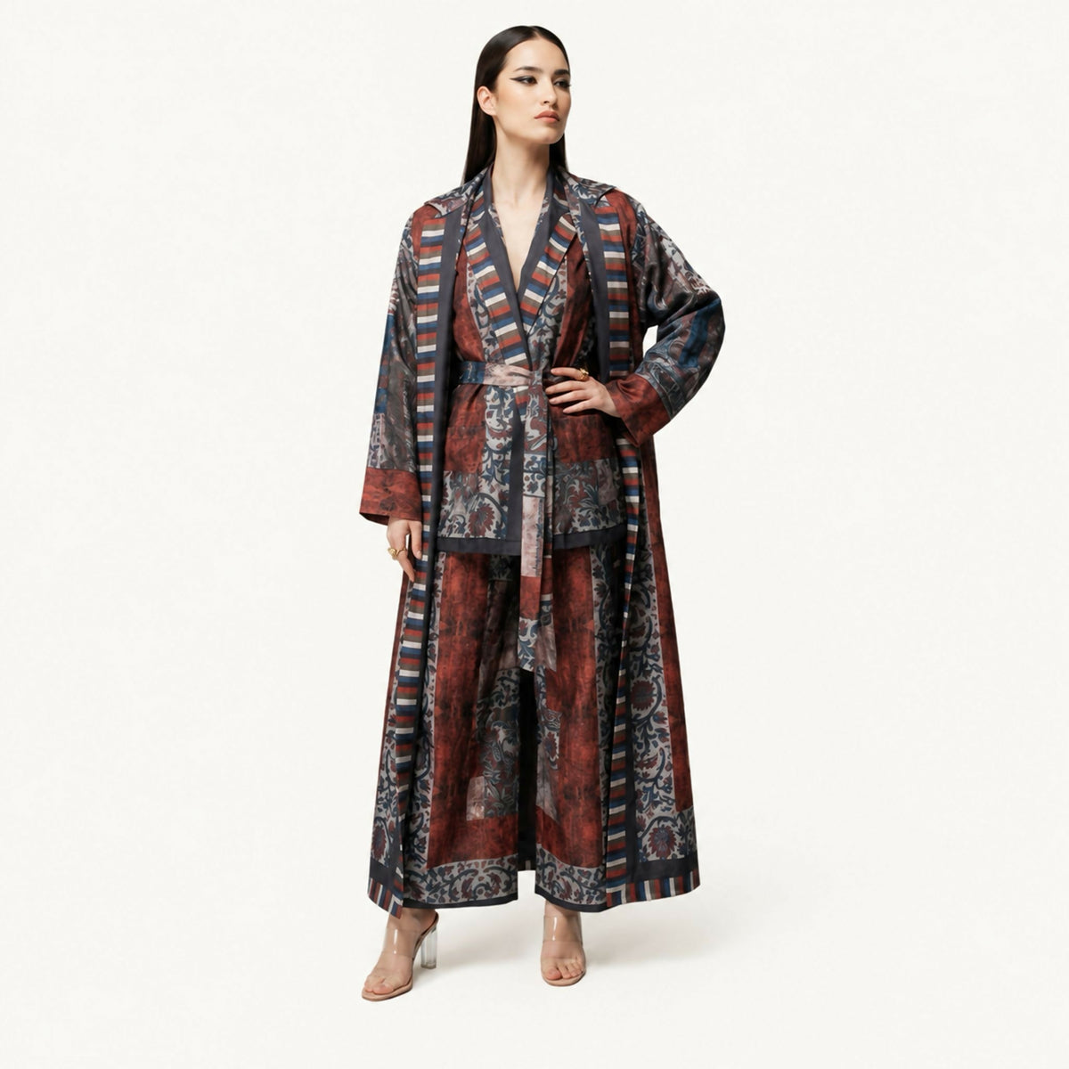 An elegant co-ord set featuring nature-inspired prints, long jacket and belted shirt, and wide-leg trousers, designed to combine comfort with timeless sophistication.