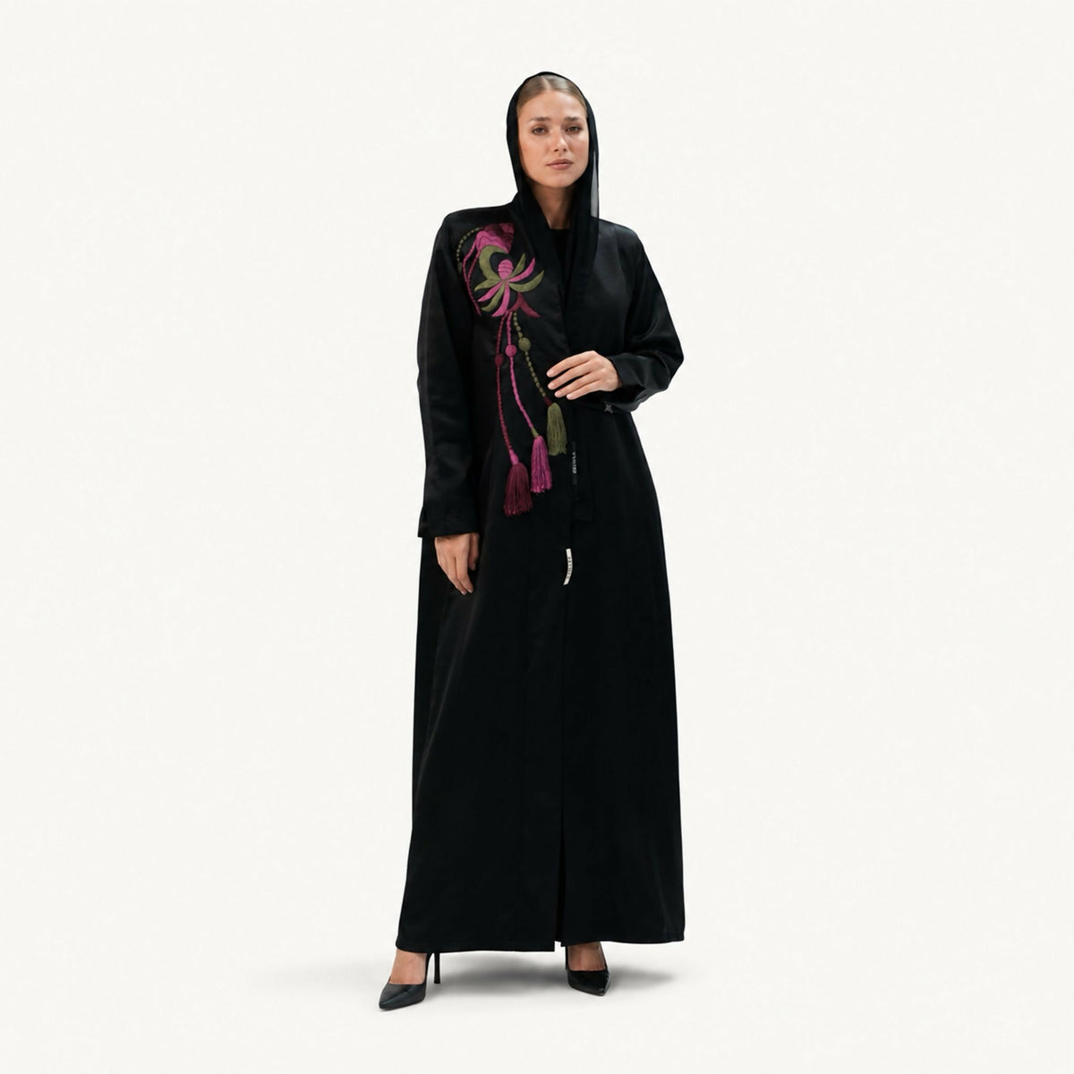 Elegant abaya featuring handcrafted woven thread detailing inspired by artistic craftsmanship. Designed with a flowing silhouette that beautifully blends artisanal craftsmanship with modern elegance, making it perfect for a variety of occasions