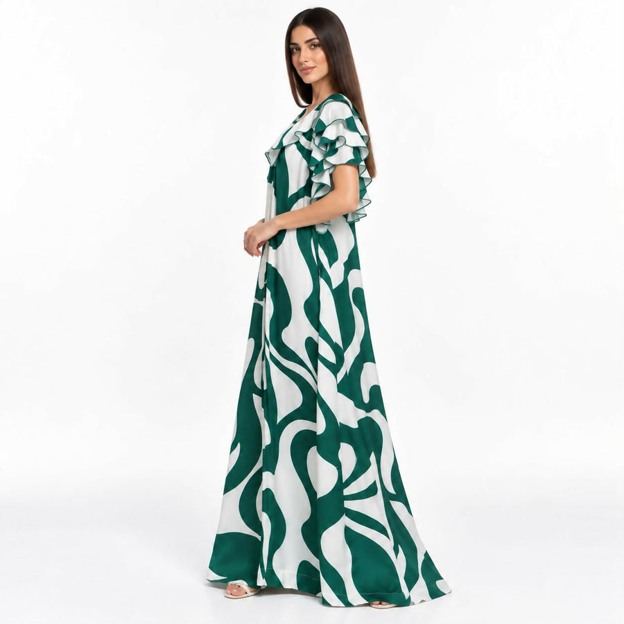 Relaxed A-line maxi dress with an allover multicolor floral print, ruffled neckline, and flutter sleeves, with a side slit.