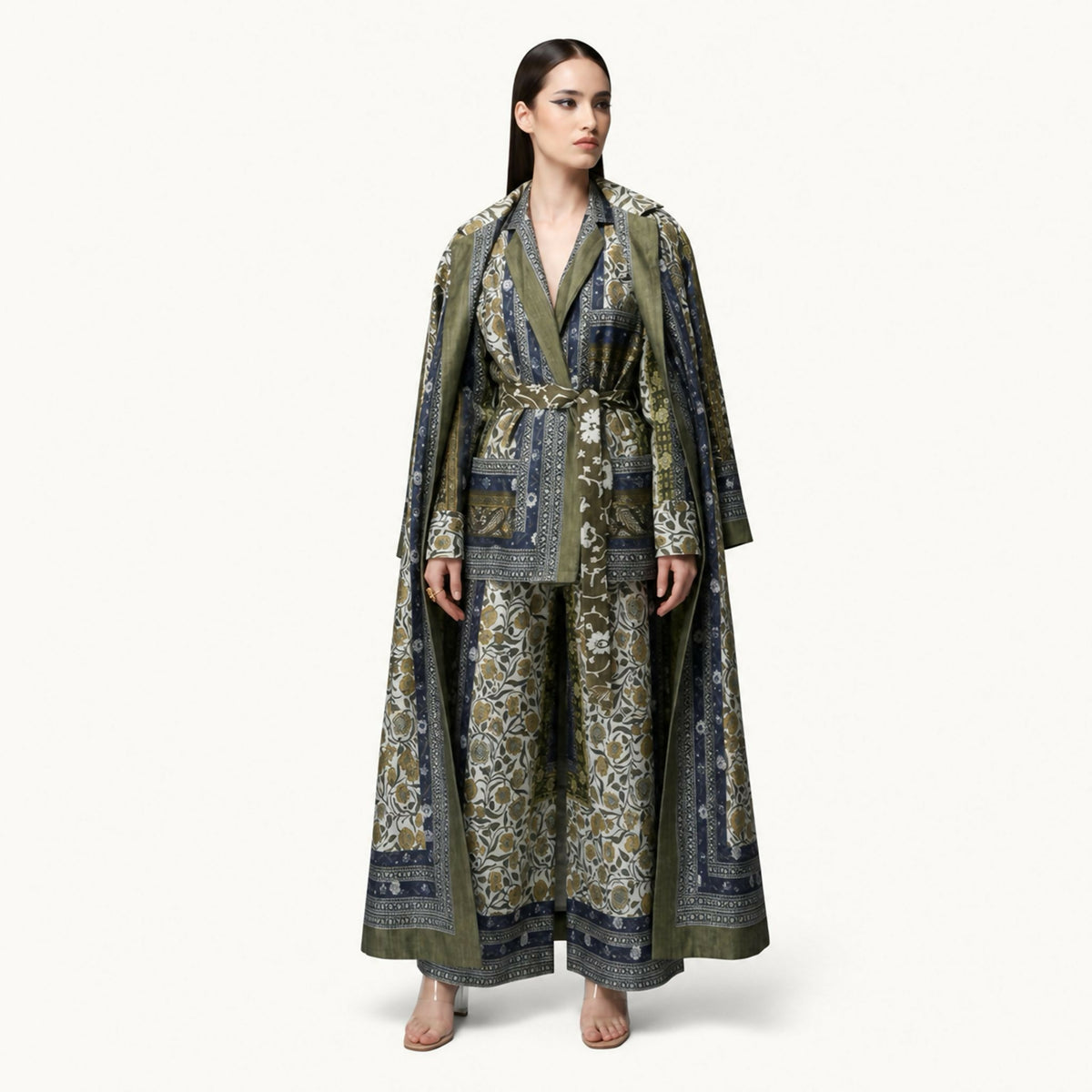 An elegant co-ord set featuring nature-inspired prints, long jacket and belted shirt, and wide-leg trousers, designed to combine comfort with timeless sophistication.