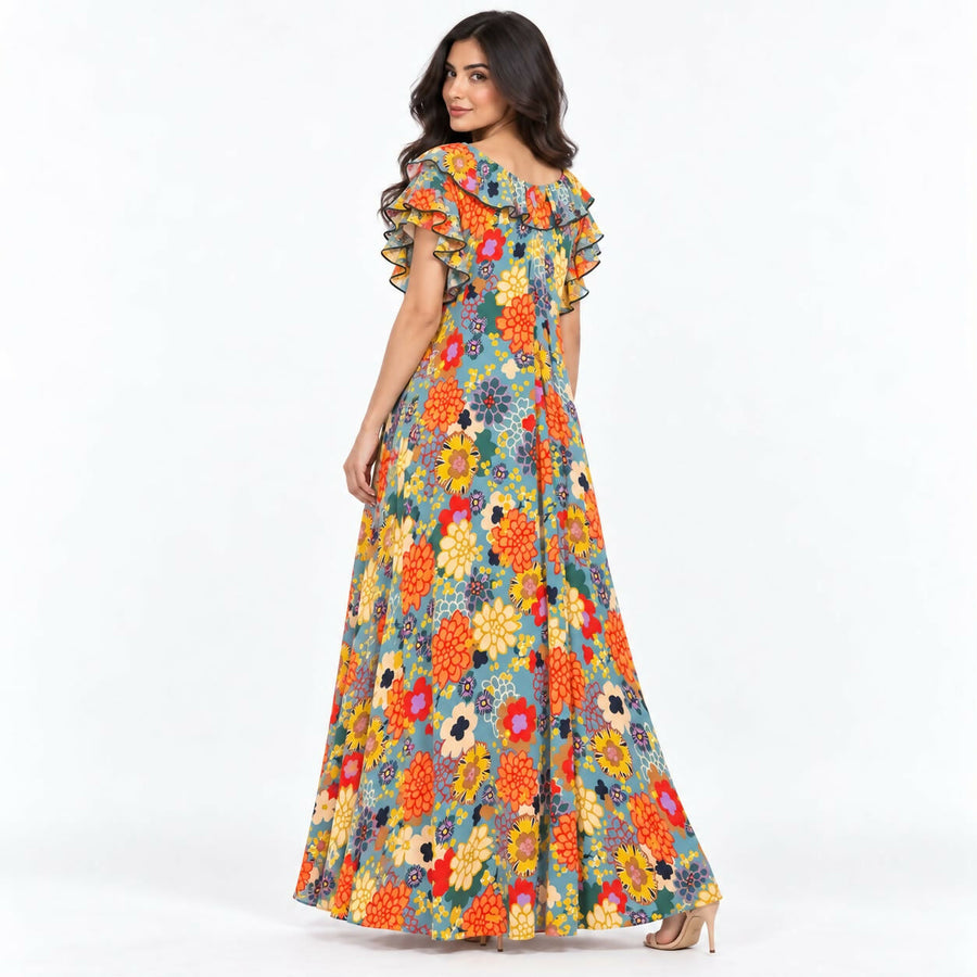Relaxed-fit maxi dress in a bold teal-and-cream abstract swirl print, with a ruffled neckline and flutter sleeves.
