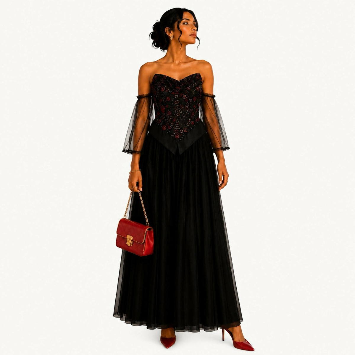 Black dress with sequined front panels and cuffs in a gold-and-black mosaic pattern, V-neckline trimmed in sequins, long sleeves