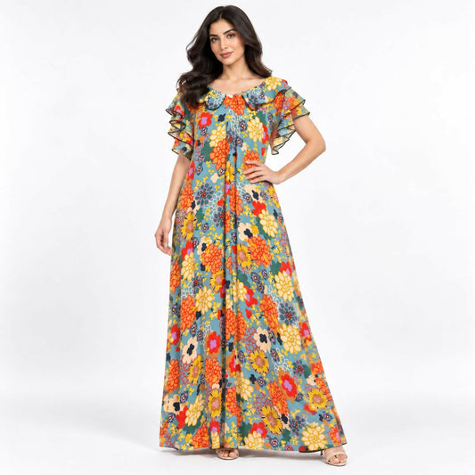 Relaxed-fit maxi dress in a bold teal-and-cream abstract swirl print, with a ruffled neckline and flutter sleeves.