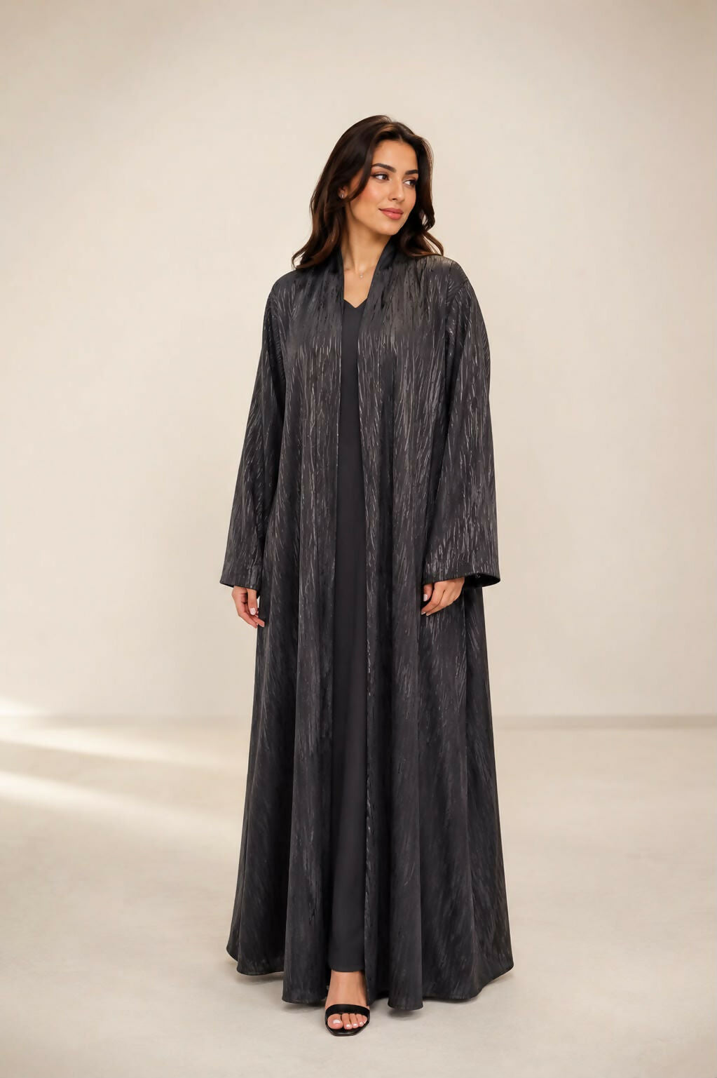 Pure silk abaya in black with soft, light blended colors overlapping on the fabric. Lightweight summer fabric; steam clean.