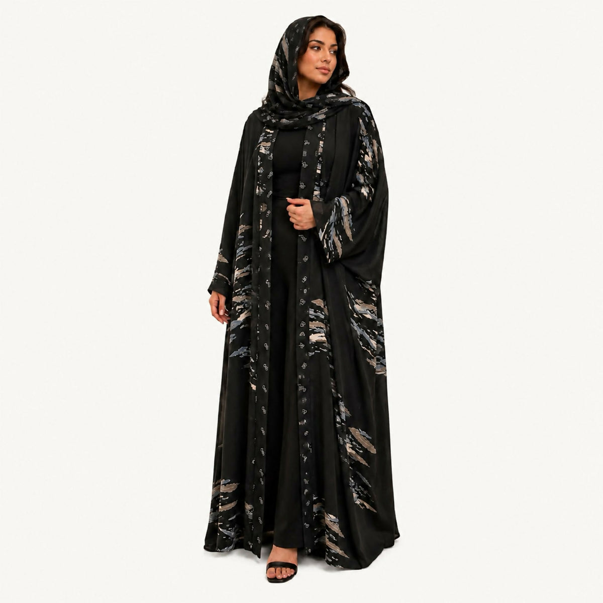 Indian silk abaya, bisht-style cut, in black with off-white and grey shapes, square sleeves, loose and lightweight. Hand wash or steam clean.
