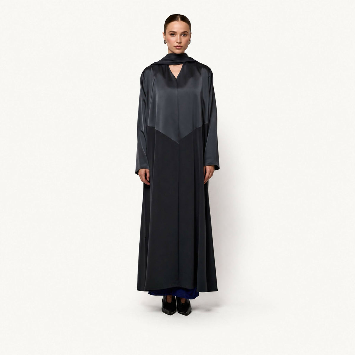 Sophisticated satin abaya with an attached draped scarf/collar detail, V-neck cutout, and color-blocked grey and black paneling.