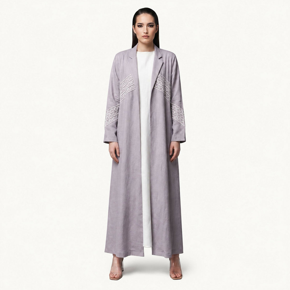 Sophisticated blazer abaya featuring a refined tailored silhouette with luxurious geometric embroidery. Thoughtfully crafted with intricate details that add a distinctive touch of elegance, making it the perfect choice for special occasions and polished,