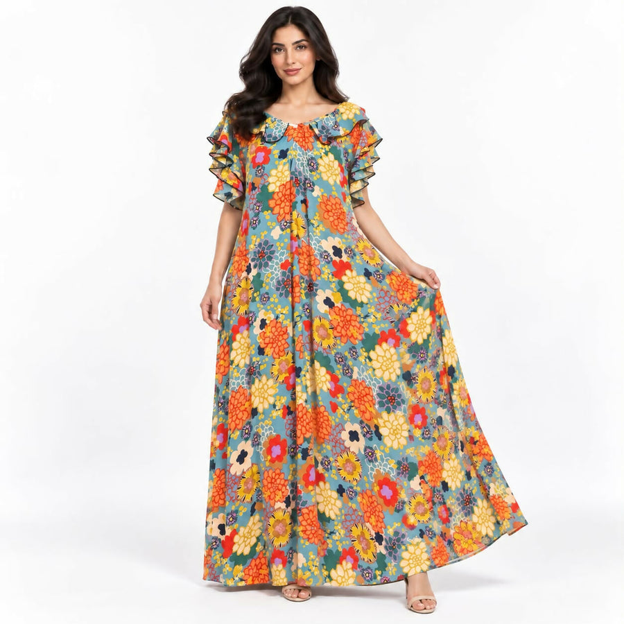 Relaxed-fit maxi dress in a bold teal-and-cream abstract swirl print, with a ruffled neckline and flutter sleeves.