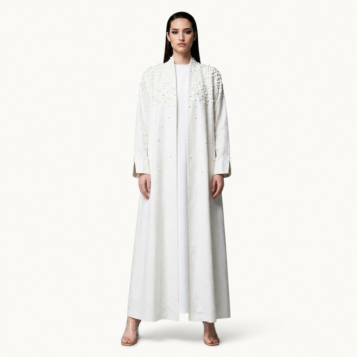 Modern abaya with a matching shawl, featuring delicate hand-embroidered 3D beadwork on the collar and shoulders. Combining timeless elegance with a contemporary design, its flowing silhouette creates a refined look suitable for a variety of occasions