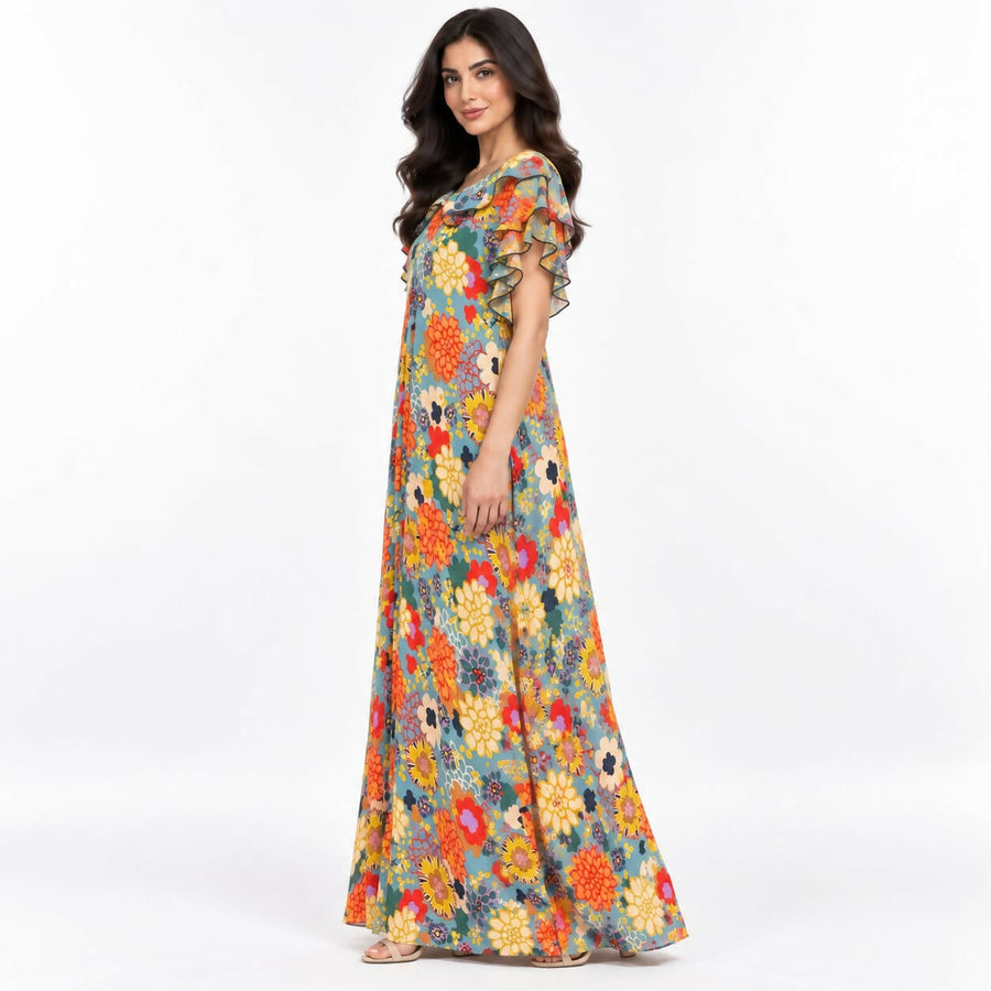 Relaxed-fit maxi dress in a bold teal-and-cream abstract swirl print, with a ruffled neckline and flutter sleeves.