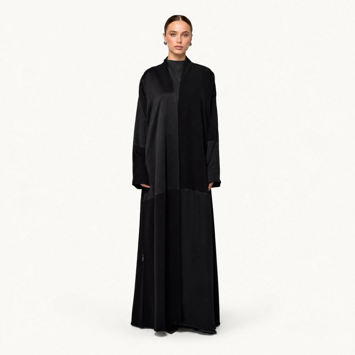 Open-front abaya with a satin upper yoke and matte lower body, shawl-style collar, and long dolman sleeves with satin cuff panels.