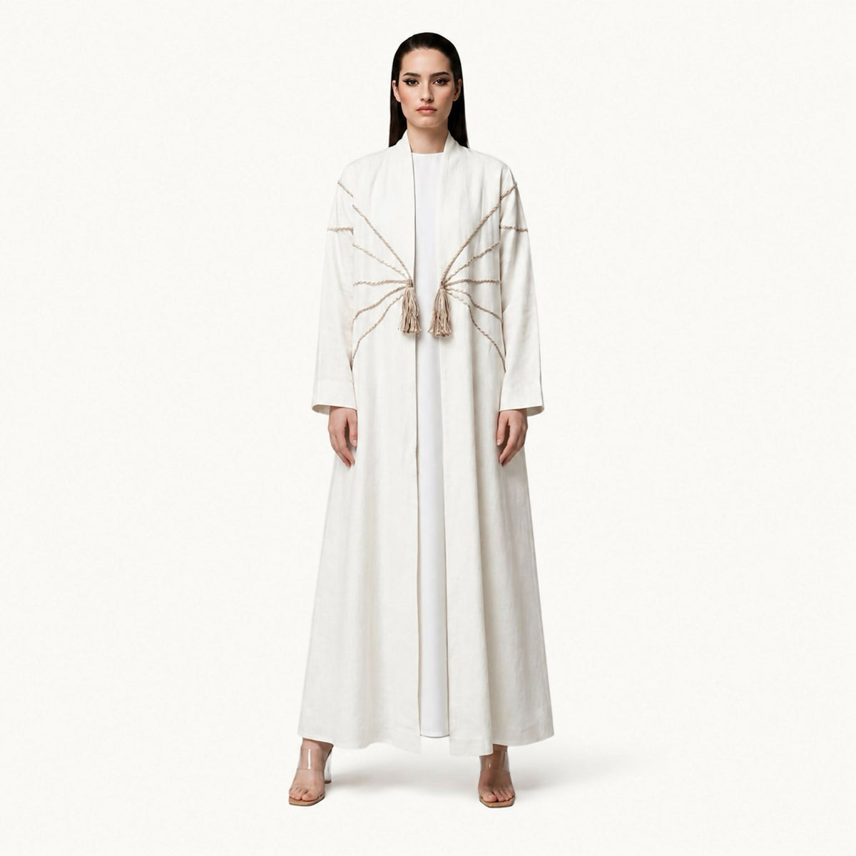 Sophisticated abaya featuring intricate 3D hand-embroidered silver floral detailing gracefully distributed throughout the design. Blending exceptional craftsmanship with contemporary elegance, it creates a refined look perfect for a variety of occasions