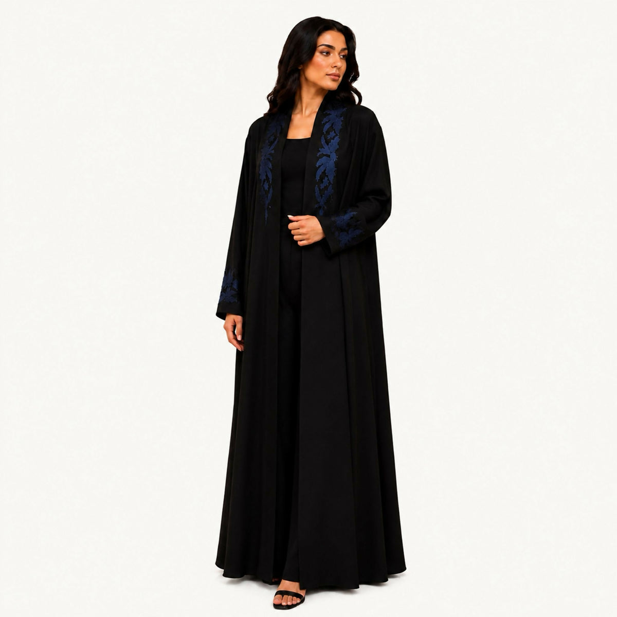 Navy black crepe abaya with tonal navy embroidery plus a front cut styled as two overlapping pieces forming a semicircle. Works for summer and winter; hand wash or steam clean.