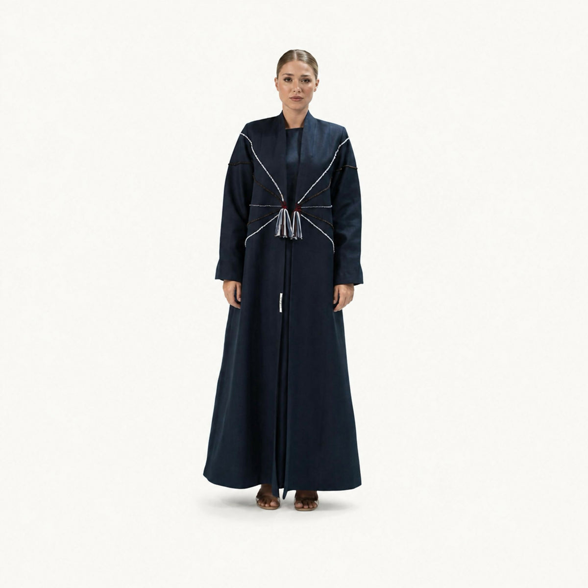 A modern long blazer featuring elegant floral embroidery along the lapels and shoulders, combining timeless sophistication with artistic detailing. Designed with a graceful silhouette for a refined look suitable for a variety of occasions