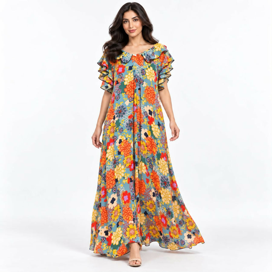 Relaxed-fit maxi dress in a bold teal-and-cream abstract swirl print, with a ruffled neckline and flutter sleeves.