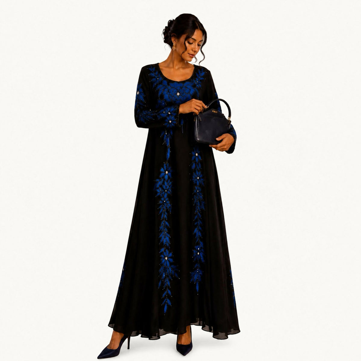 Green chiffon dress with long sleeves, embroidered with royal blue floral and leaf motifs down the bodice and sleeves with scattered crystal accents, round neckline, and a flowing wide-cut skirt