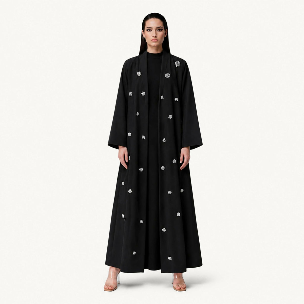 Modern abaya with a matching shawl , featuring intricate handcrafted woven thread detailing that adds a refined artistic touch. Designed with a graceful silhouette, it offers an elegant look suitable for a variety of occasions
