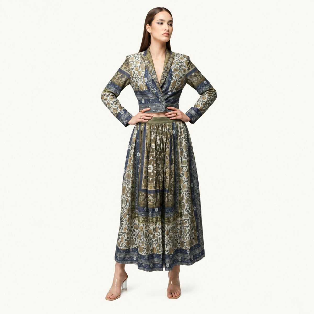 An elegant co-ord set featuring nature-inspired prints, long jacket and belted shirt, and wide-leg trousers, designed to combine comfort with timeless sophistication