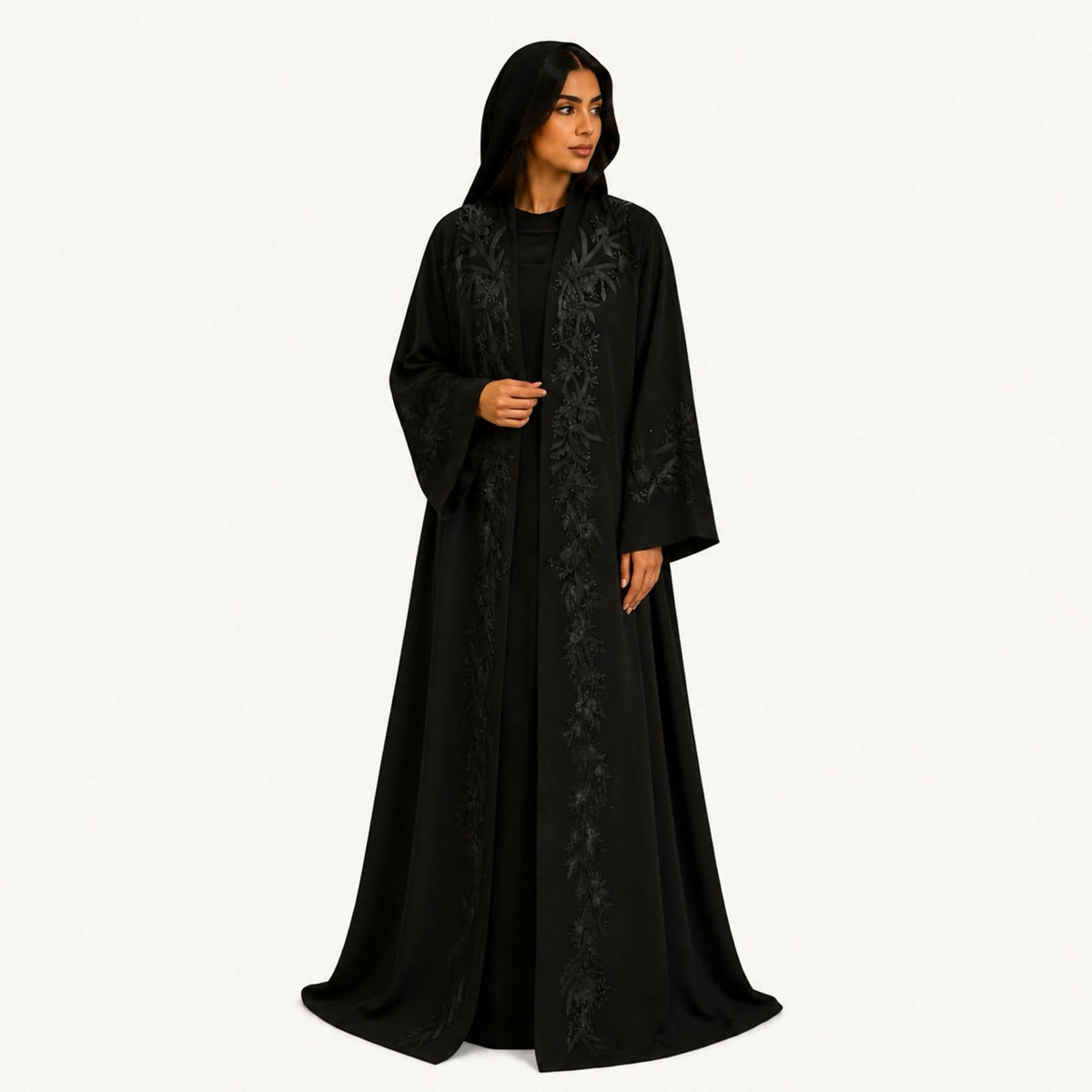 Black crepe abaya with navy front embroidery styled as lines and dots along the lower front width. Hand wash or steam clean.