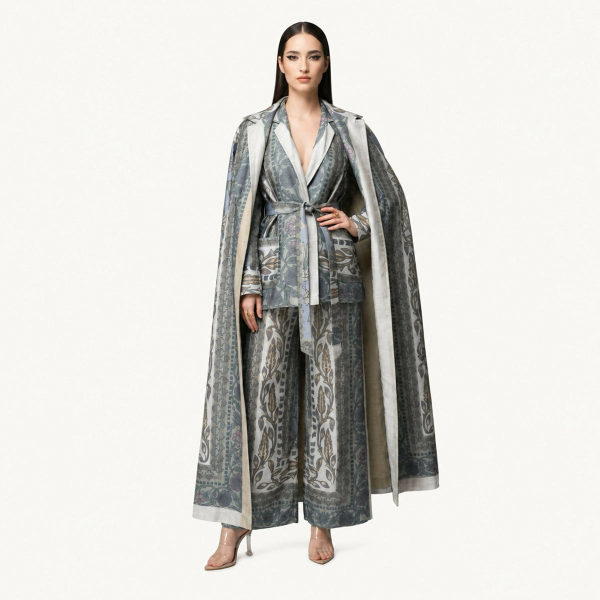 An elegant co-ord set featuring nature-inspired prints, long jacket and belted shirt, and wide-leg trousers, designed to combine comfort with timeless sophistication.